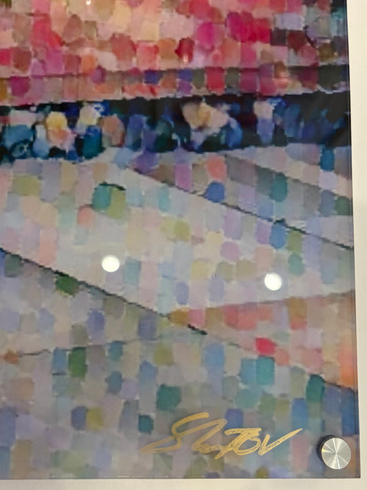 Colorful fabric swatches with a brand logo on a wooden surface